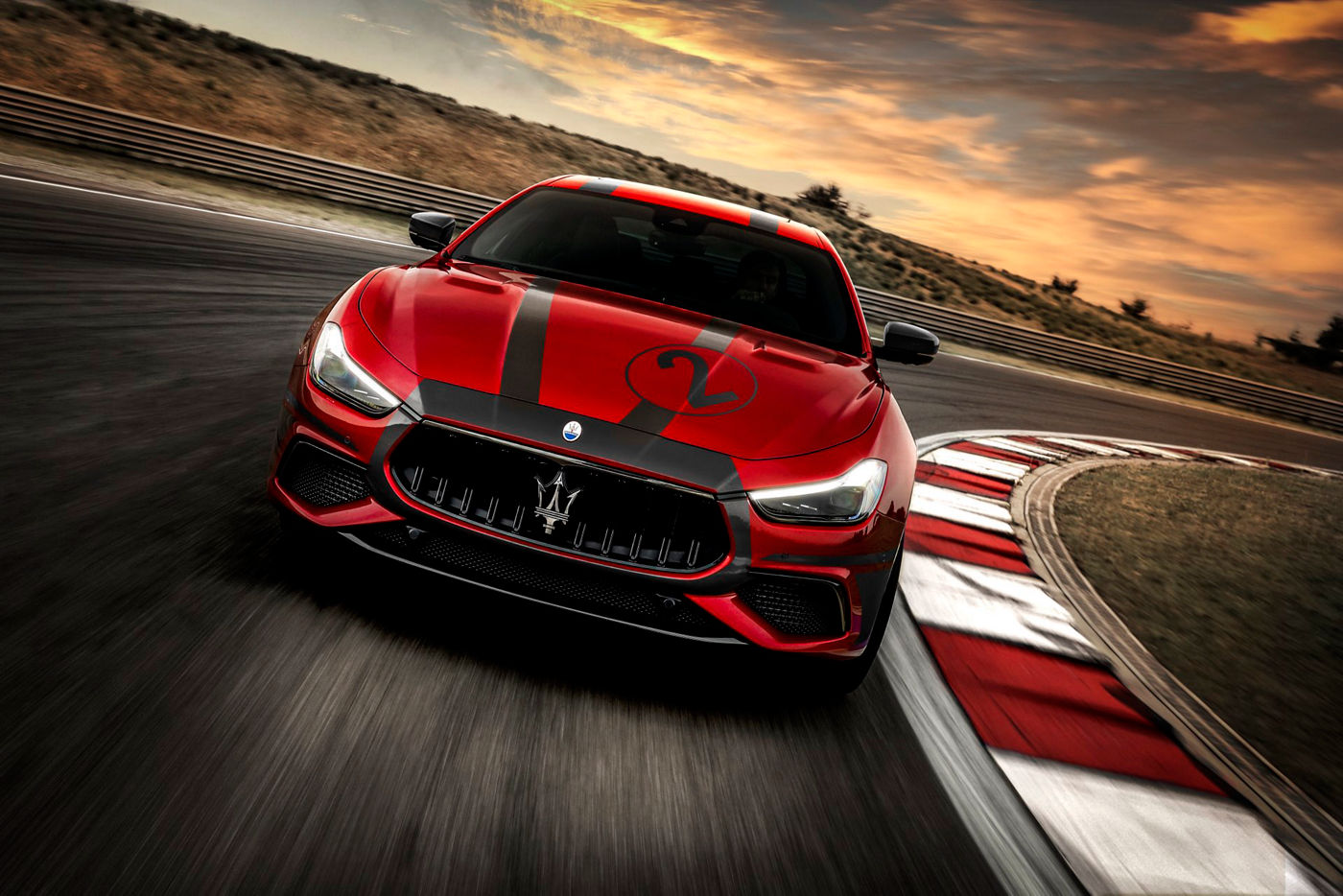 Red Maserati GranTurismo in motion on the street