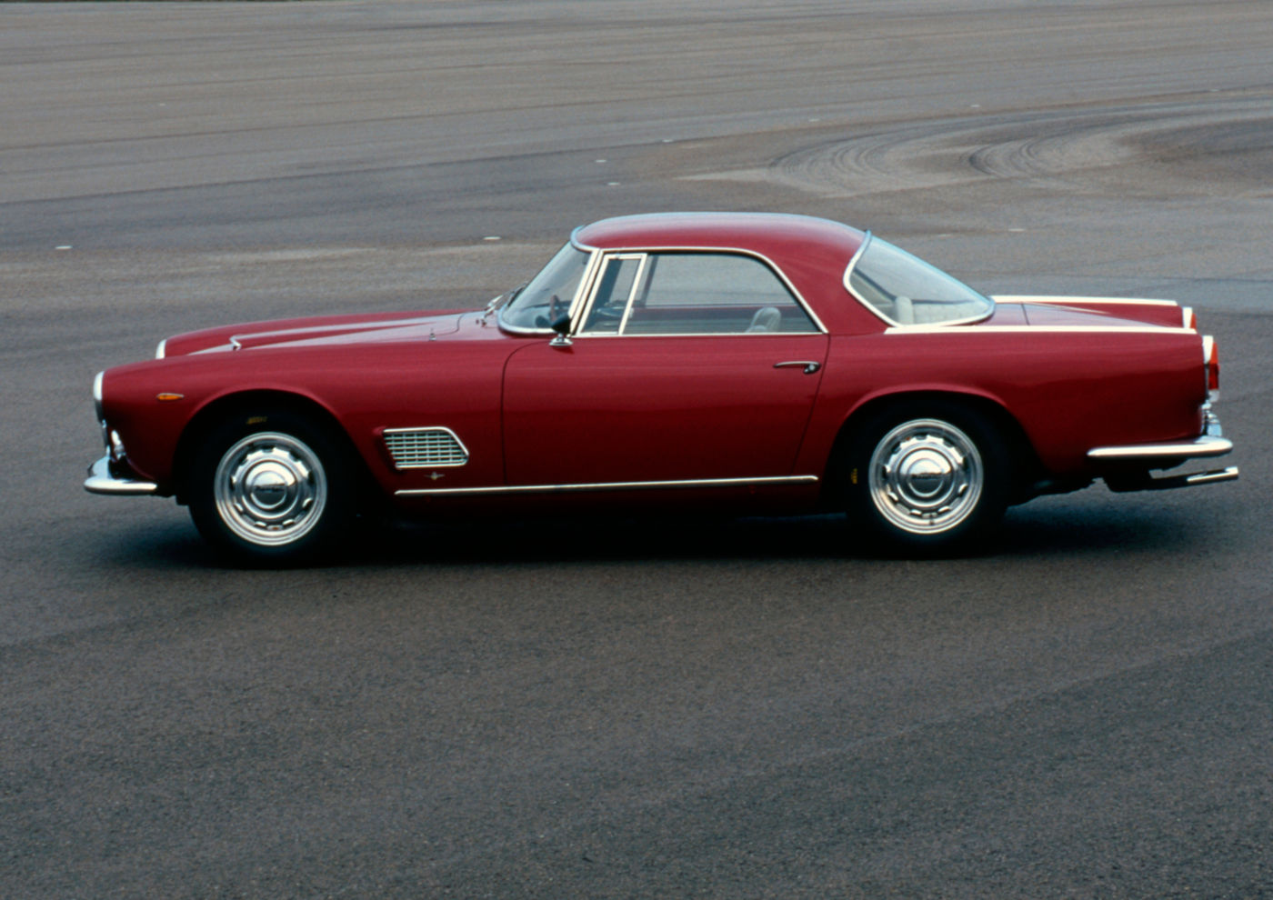 1957 Maserati 3500GT - side view of a classic car model in red