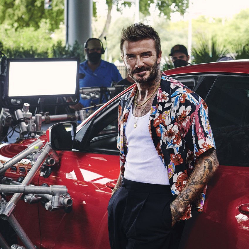 David Beckham leaning on Maserati Levante Trofeo