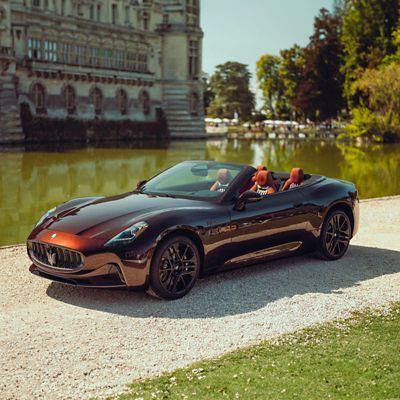 Maserati GranCabrio Folgore Folgore Tignanello parked in front of the Chantilly castle