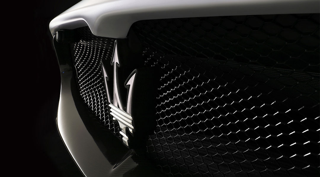Closeup of Maserati logo on Bumper