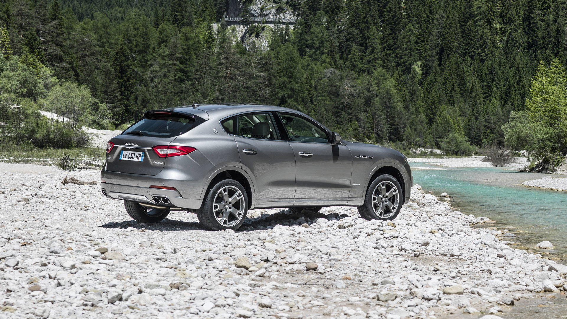 Maserati Levante grey - rear and side view- river landscape perspective