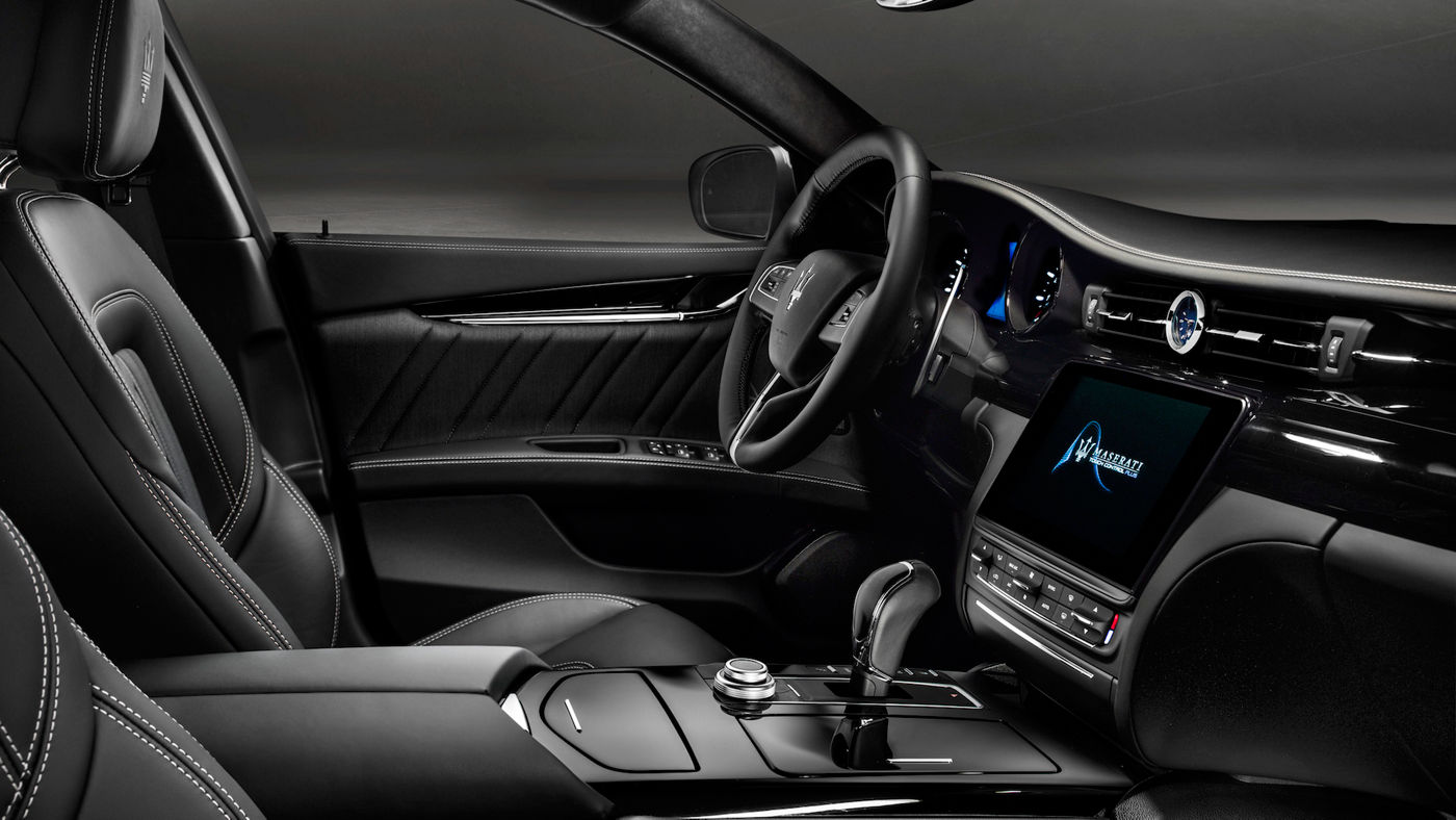 Maserati Quattroporte performance car - dashboard and interior black leather design details