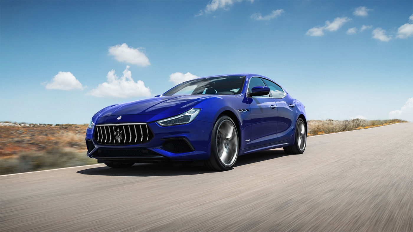 Maserati Ghibli GranSport - Ghibli front and side view, riding on a country road