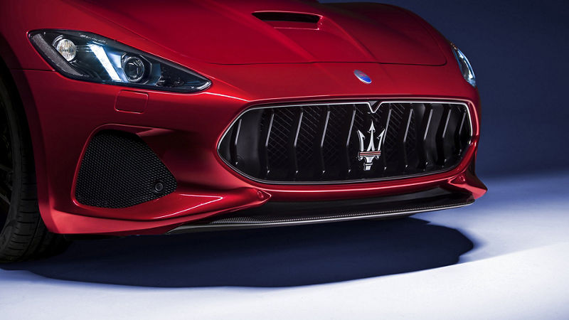 Maserati GranTurismo front view,  detail of headlights and bumper with logo