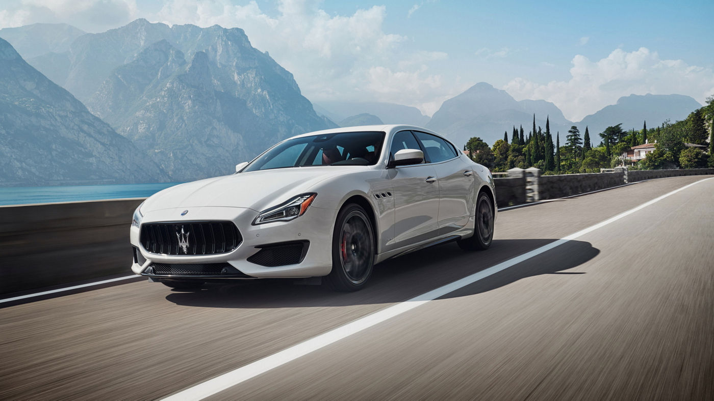 Maserati Quattroporte GTS – the luxury sedan in Bianco color on the road