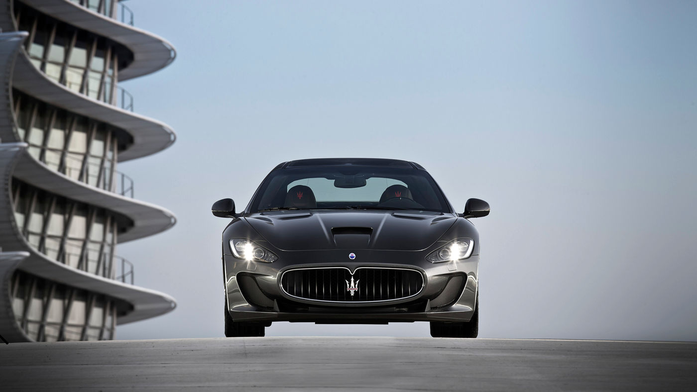 Grey Maserati GranTurismo Hero - Front view - On the road