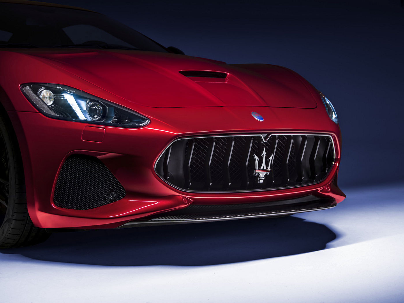 Red Maserati GranTurismo - front details with the trident emblem