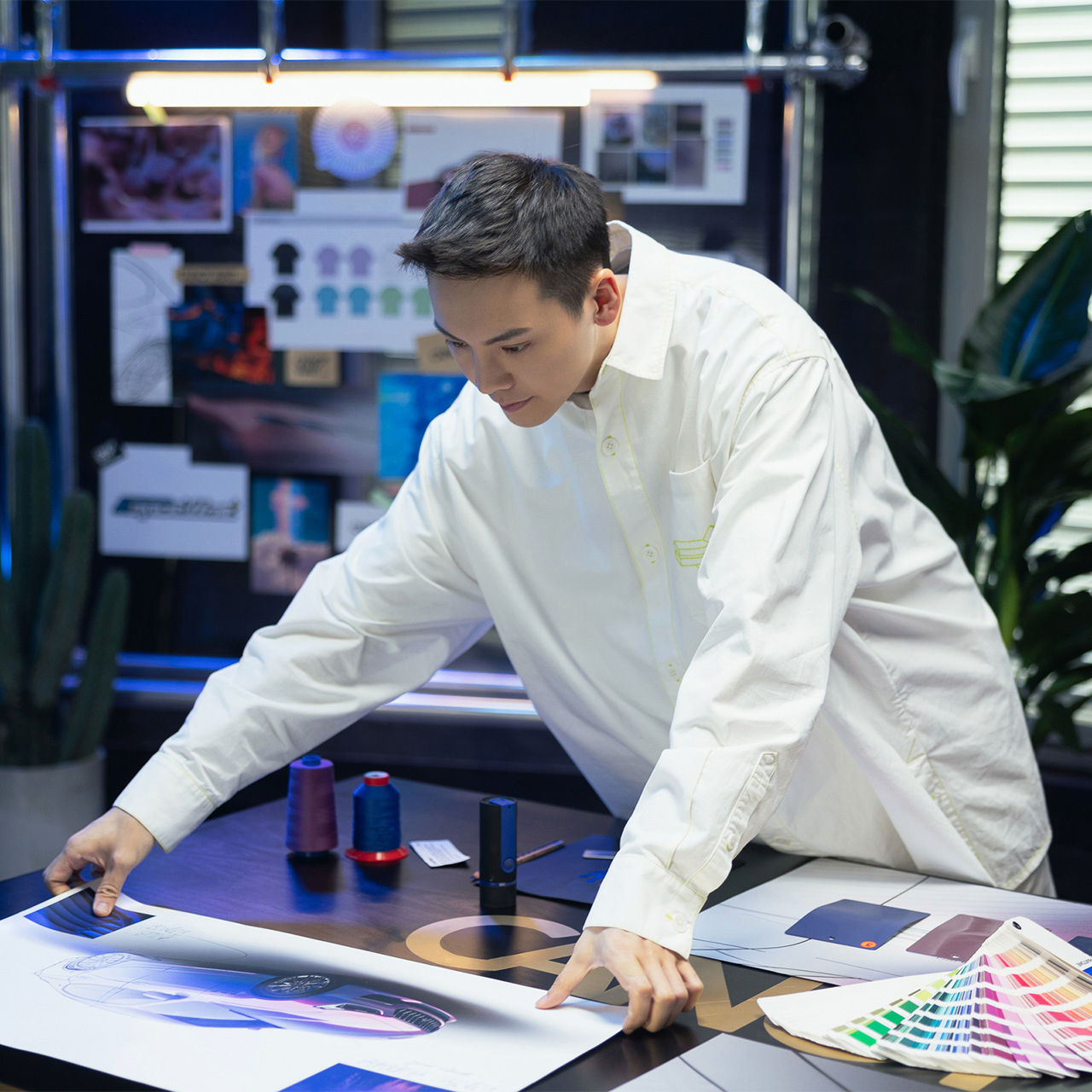 William Chan looking at prototype images of Ghibli Hybrid