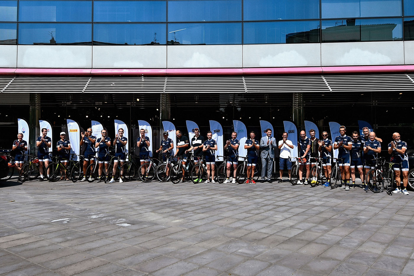 Cyclists in front of Maserati headquarters