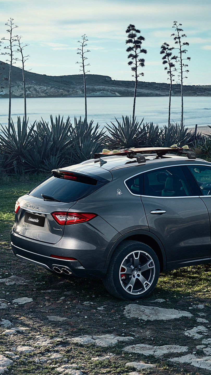 Maserati Levante in front of lake or river