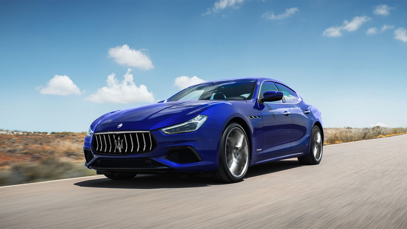 Maserati Ghibli on the road - front and side view - blurred background