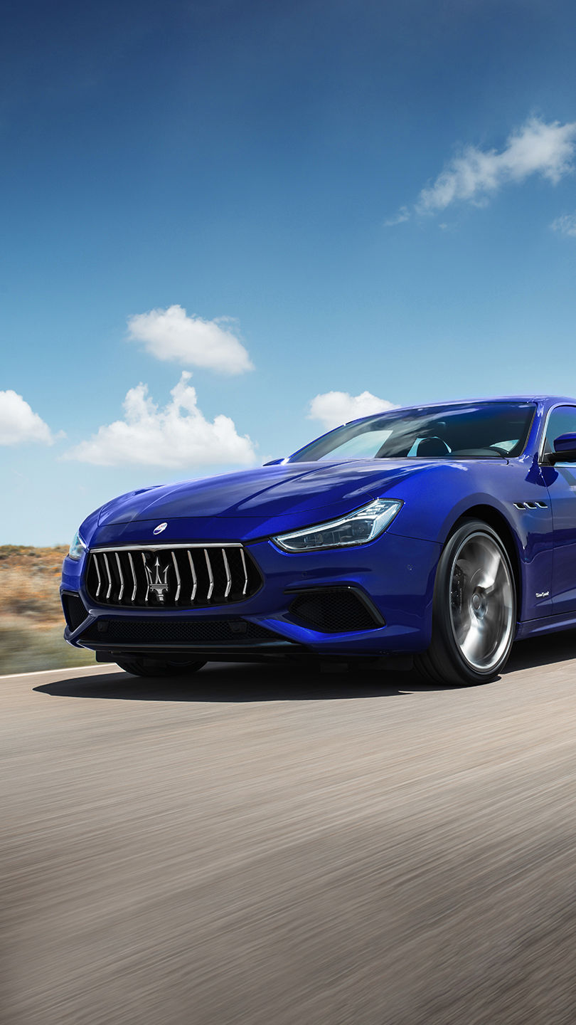 Maserati Ghibli on the road - front and side view - blurred background