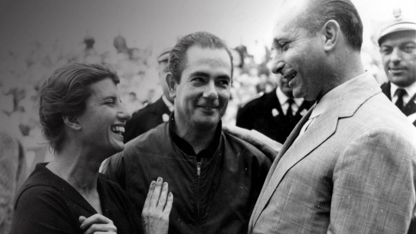 Fangio and two others in a black and white picture