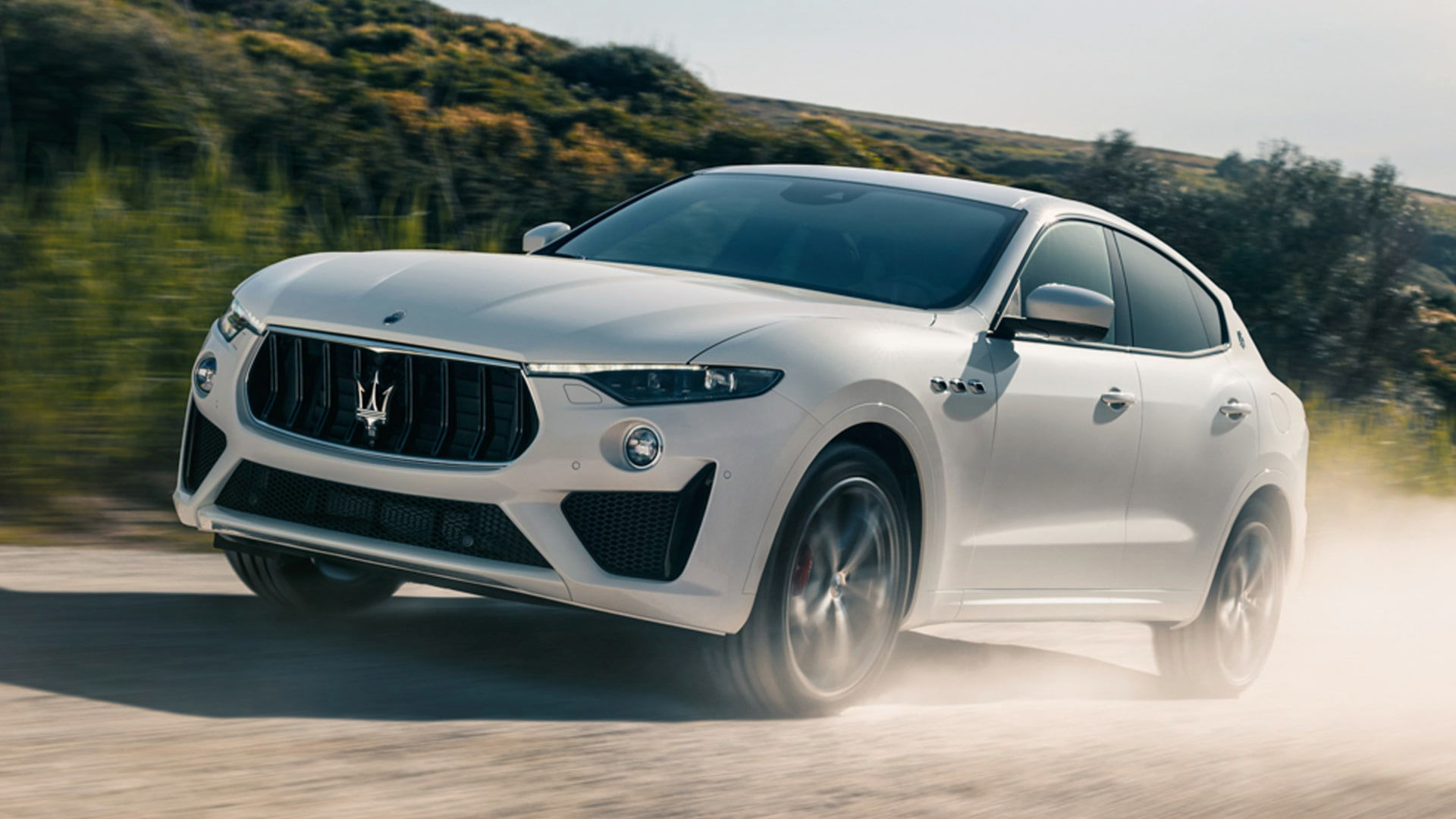 Maserati Levante on a gravel road, front and side view - off-roading