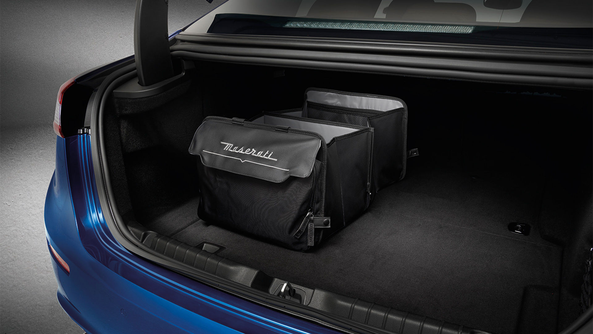 Containers inside the trunk of Maserati Ghibli