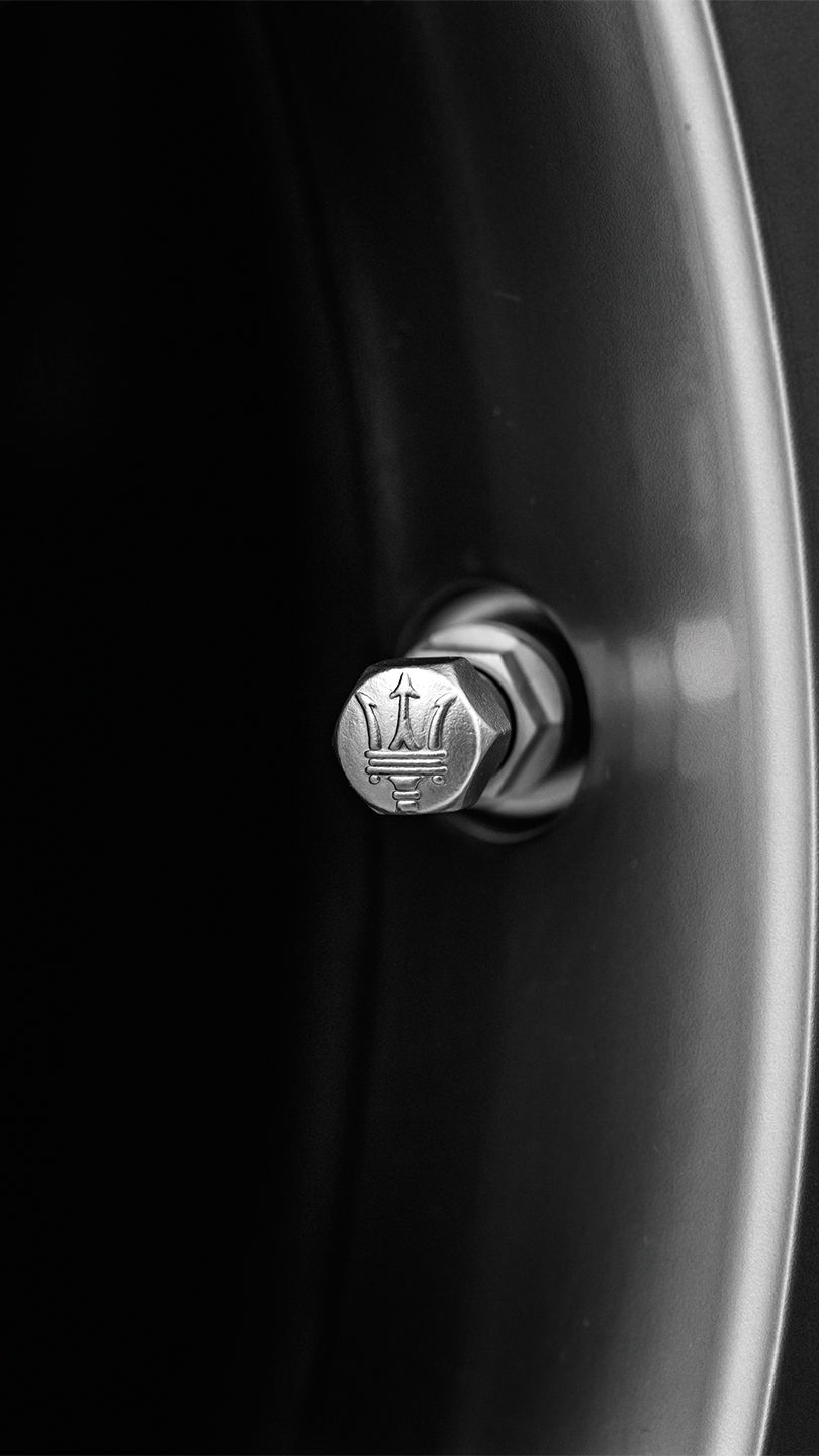 Bolt with Maserati trident logo