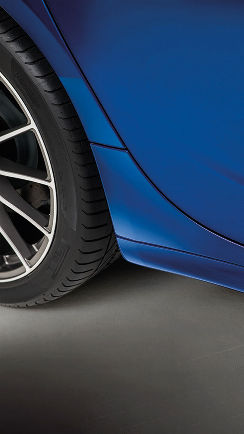 Detail of the door of a blue Maserati Ghibli