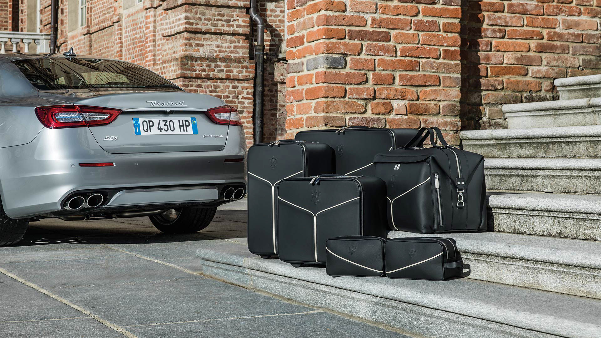 Luggage with Maserati and Maserati Quattroporte logos