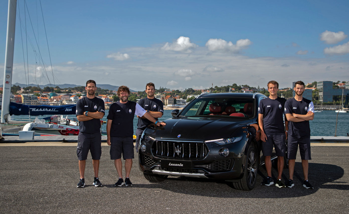 01 Giovanni Soldini (second from left) and the Maserati Multi 70 crew with the Maserati Levante in Cascais