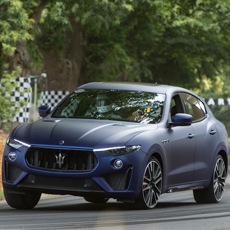 Maserati Levante Trofeo at Goodwood Festival, front view, racing on the road
