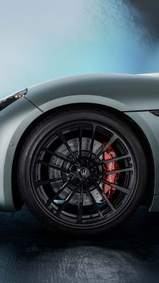 Left front wheel with red brake calipers of the slate grey Maserati GranCabrio