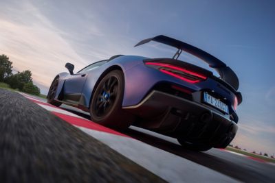 maserati-gt2-stradale-passing-over-a-curb-left-view-desktop